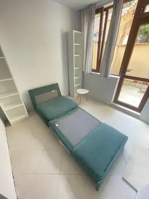 a room with a bean bag chair and a couch at Top Center 2-BR Apartment with lovely Outdoor Area in Plovdiv