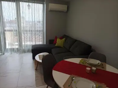 a living room with a couch and a table at One Bedroom Apartment 37- Trakia 54 А in Plovdiv