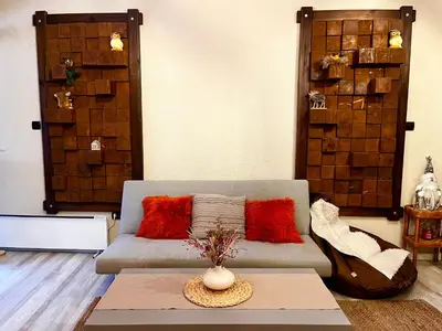 a living room with a couch and a table at Roots Apartment 2 in Borovets