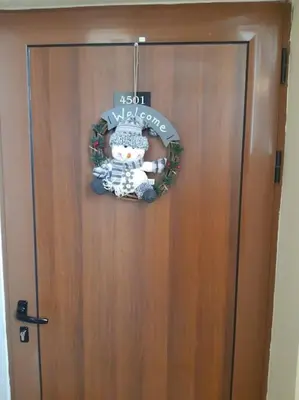 a door with a christmas wreath on it at Gondola lift apartment in Bansko