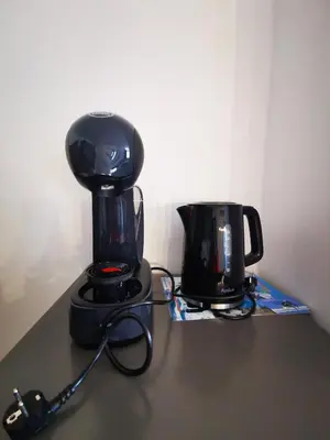 a coffee maker and a coffee pot on a counter at Viva 4 Apartment ski to the door complex Grand Monastery Pamporovo in Pamporovo
