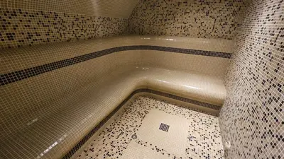 a bath tub in a tiled bathroom with a shower at Апартамент Bella Casa in Beli Iskar