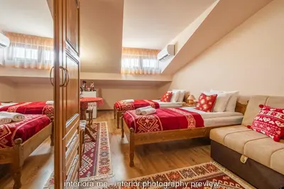 a living room with two beds and a couch at MOMA - Charming home in the heart of Bansko Ancient Center in Bansko
