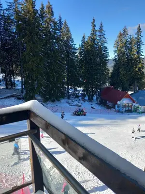 a view of a ski slope with snow on the ground at Апартамент в хотел Стената, Пампорово in Smolyan