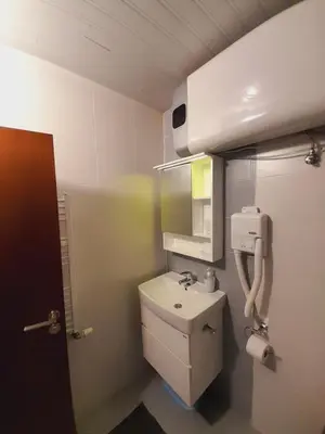 a small bathroom with a toilet and a sink at Belvedere Holiday Club h 305 in Bansko