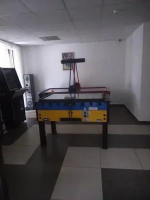 a ping pong table sitting in a room with a table at Belvedere Holiday Club h 305 in Bansko