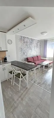 a living room with a couch and a table at Belvedere Holiday Club h 305 in Bansko