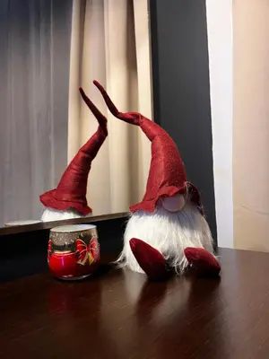 two gnomes sitting on a table in front of a mirror at Studio Nr 6 in Bansko