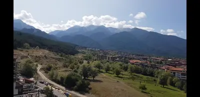 a view of a city and a mountain range at Pirin and Bansko view Studio in Bansko