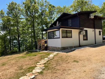 a house on top of a hill with trees at Villa Elias in Zlatograd