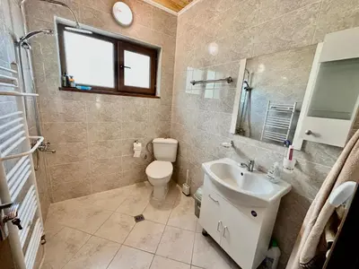 a bathroom with a toilet and a sink at Къща за гости “Александър” in Velingrad