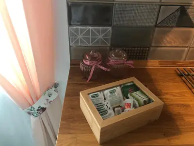 a wooden box sitting on a wooden floor next to a window at Lavender Suite in Dragichevo