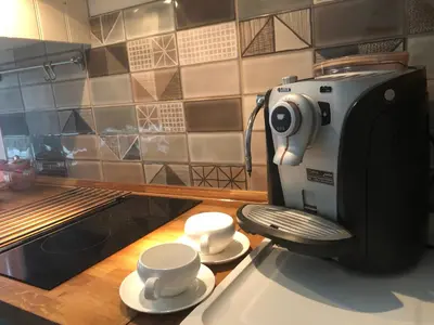 a coffee machine sitting on a counter in a kitchen at Lavender Suite in Dragichevo