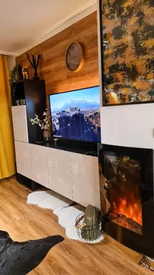 a living room with a tv and a fireplace at Apartmanica Double room apartment 101-12, with AC, big terrace, St Ivan Rilski 4 star SPA Resort, Bansko in Bansko