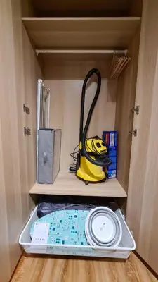 a yellow vacuum in a drawer of a room at Apartmanica Double room apartment 101-12, with AC, big terrace, St Ivan Rilski 4 star SPA Resort, Bansko in Bansko