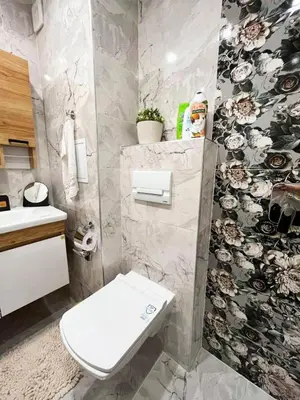 a bathroom with a toilet and a sink at Central Apartment near the Park in Gotse Delchev