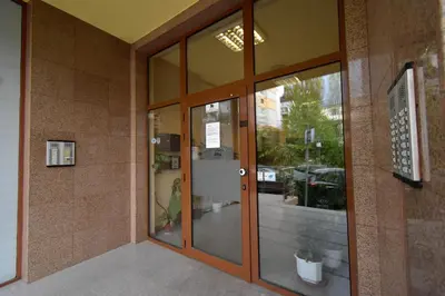 an entrance to a building with sliding glass doors at Panoramic Terrace City View Suite in Sofia Center in Sofia