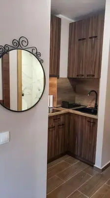 a kitchen with a mirror on the wall at BoroHome in Borovets