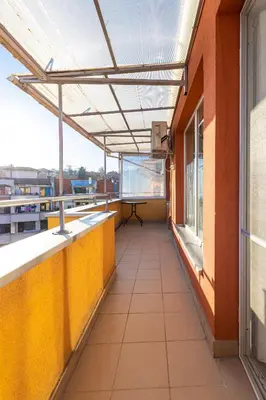 a balcony of a building with a table on it at Sunny 1BD Apartment in OLD TOWN by Flat Mаnager in Plovdiv