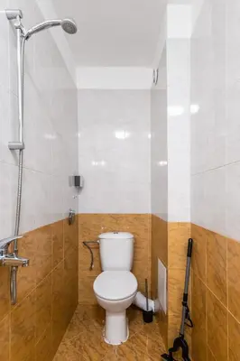 a bathroom with a toilet and a shower at Modern&Stylish Studio in City Centre by Flat Mаnager in Sofia
