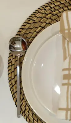 a spoon sitting next to a white plate on a table at Ski&Stay Studio Bansko in Bansko