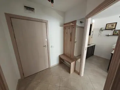 a hallway with a closet and a door in a room at Gondola Ski Lift Apartment in Bansko