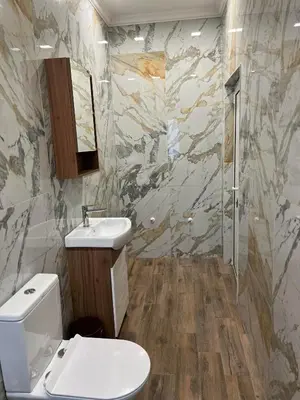 a bathroom with a toilet and a sink at Elegant and cozy room ARAKS in Kostinbrod