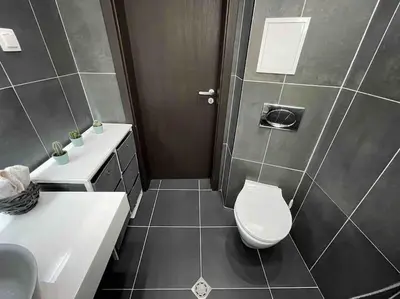 a bathroom with a toilet and a sink at Cozy & Boho Top Center Apartment in Sofia