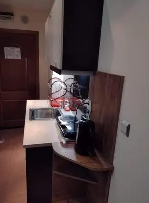 a kitchen with a sink and a counter top at Dino privates apartments Emerald in Bansko
