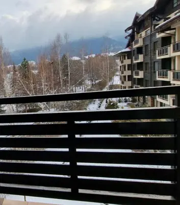 a view from a balcony of a building with snow at Apartaments by Zenit in Terra Complex B16 and D09 near Bansko in Razlog