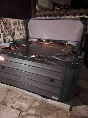 an old stove is sitting on the ground at House Trivia in Bansko
