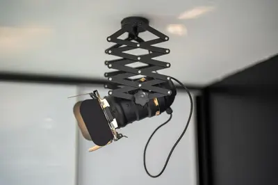 a camera hanging on a wall in a room at Stylish Cozy Studio with fireplace in Bansko