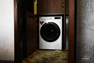 a washer and dryer in a small room at Deluxe Apartment 33 Mountain Lodge Pamporovo in Pamporovo