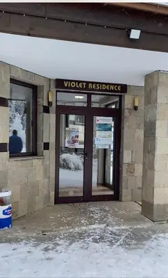a wooden door to a worker residence with a sign on it at Charming Winter Studio in Borovets