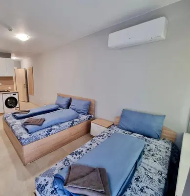 a room with two beds in a room at Top location apartment in Sofia