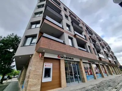 a building on a street with a store at Top location apartment in Sofia