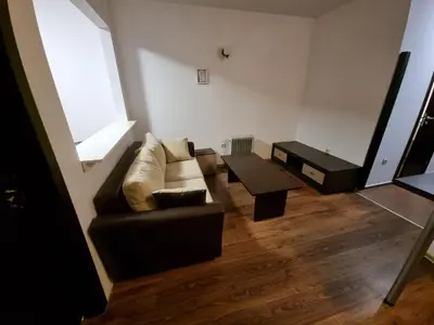 a living room with a couch and a table at Bansko Royal Towers apartment 200m from skilift in Bansko