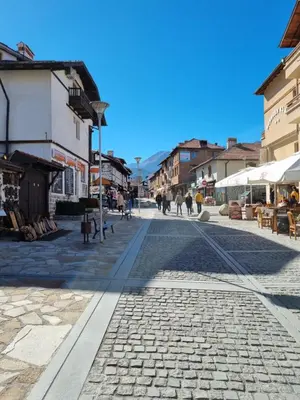 a cobblestone street in a town with buildings at Bansko Royal Towers apartment 200m from skilift in Bansko
