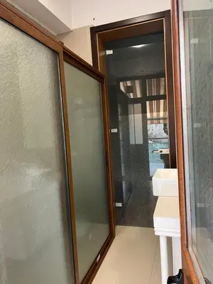 a sliding glass door in a room with a bathroom at My place - 24h Self Check-in in Sofia