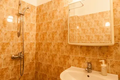 a bathroom with a shower and a sink at Tony's Sunny Rooftop Studio by Flat Mаnager in Sofia