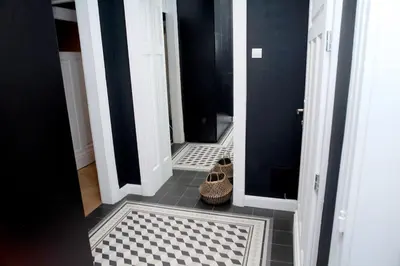 a hallway with a black and white tile floor at *CITADEL* 2BR - city center in Sofia