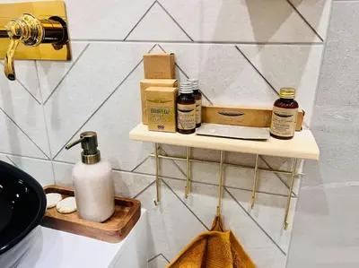 a shelf with products on it in a bathroom at Boutique lux design apartment @Bansko Royal Towers in Bansko