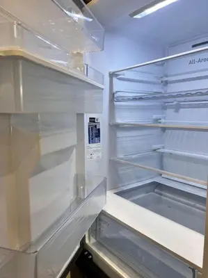an empty refrigerator with its door open in a kitchen at Boutique lux design apartment @Bansko Royal Towers in Bansko