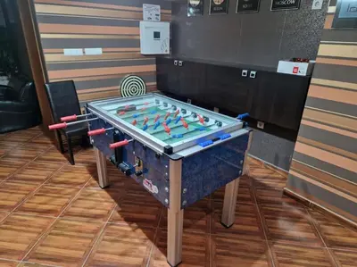 a foosball table in a room with at 1 bedroom luxury apartment Milena -free parking in Pamporovo