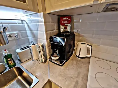 a kitchen with a coffee maker on a counter at 1 bedroom luxury apartment Milena -free parking in Pamporovo