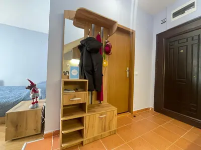 a room with a closet with a mirror and a door at Your Place Borovets in Borovets