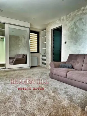 a living room with a couch and a glass house at Luxury guests house “Heaven Hill”, Pravets city in Pravets