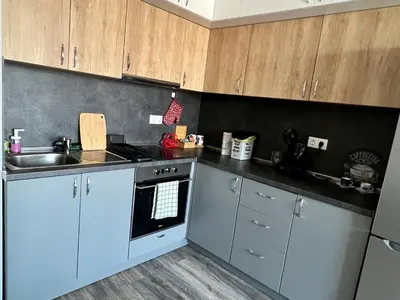 a kitchen with a sink and a stove top oven at Habitat 29 Apartment in Sofia
