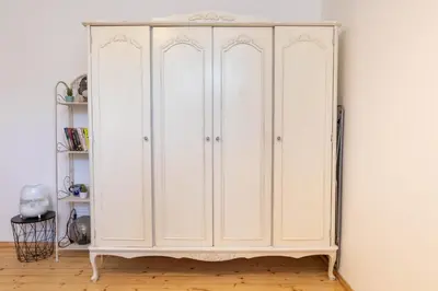 a white wardrobe in a room with a wall at Vintage bohemian Paradise with Xbox Series X for BIG groups in Sofia