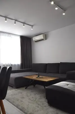 a living room with a couch and a coffee table at Orpheus and Eurydice in Smolyan